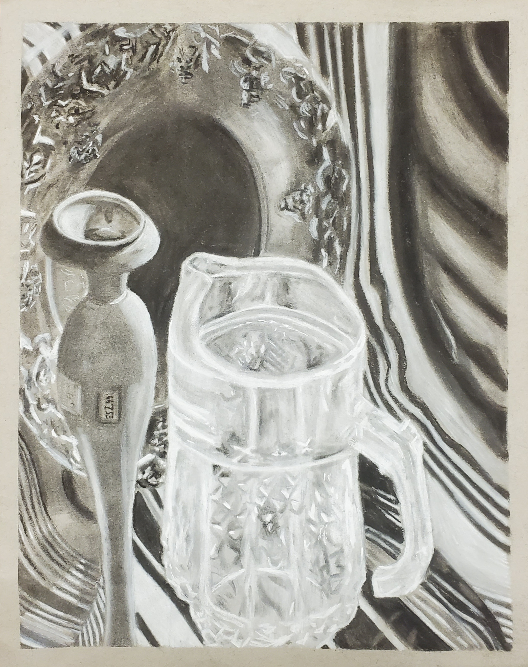Black-and-white observational study of a glass, bottle, reflective tray, and draped fabric